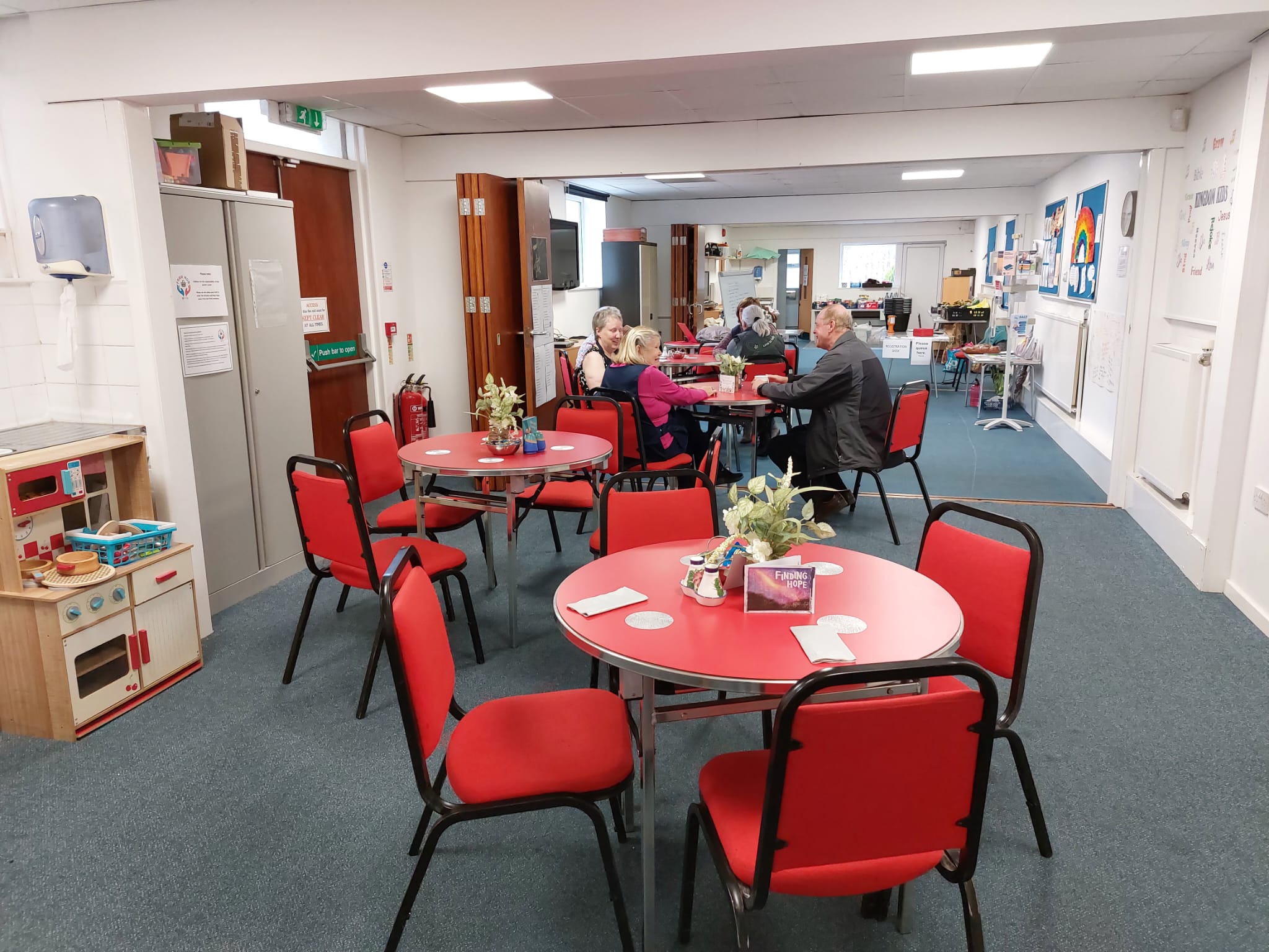 Room with tables laid out as a shop